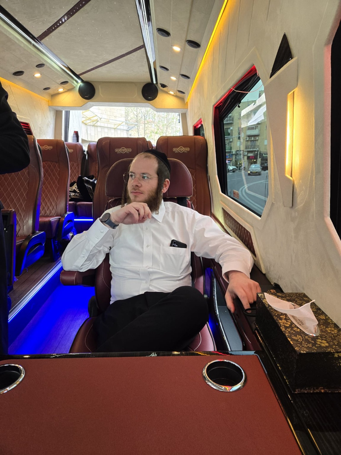 Sruly sitting in a luxury bus
